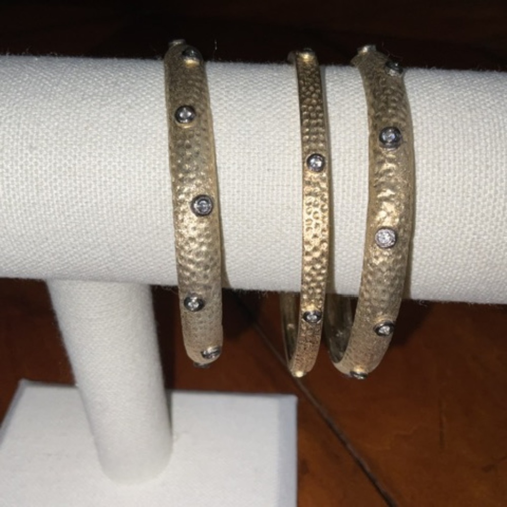 Set of Three. Gold bangle bracelets. New